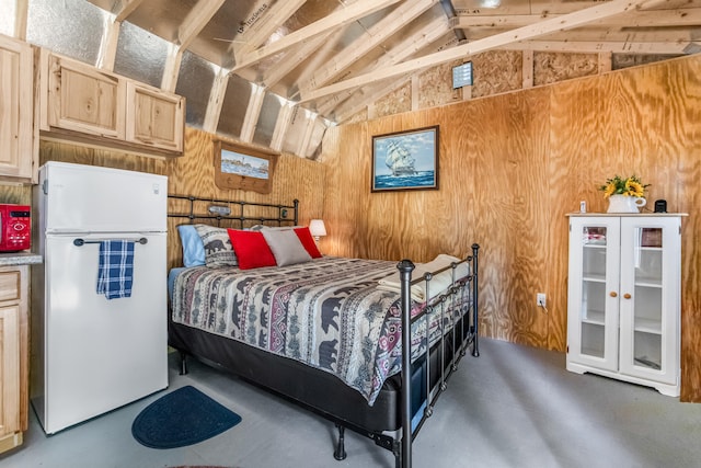 bedroom with white refrigerator, lofted ceiling with beams, and wooden walls