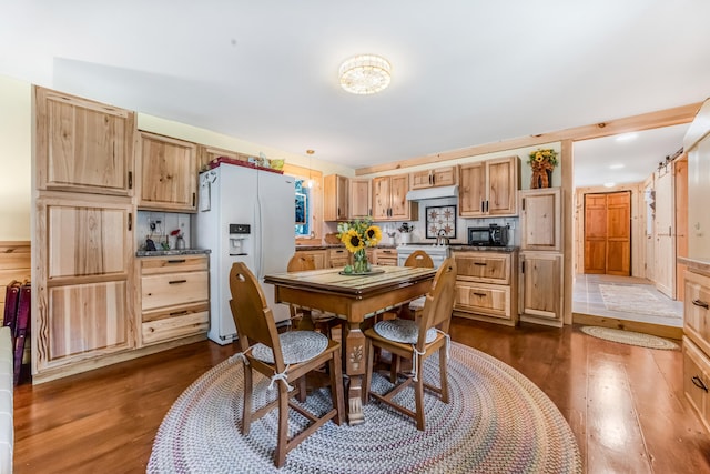 dining area featuring dark wood-type flooring