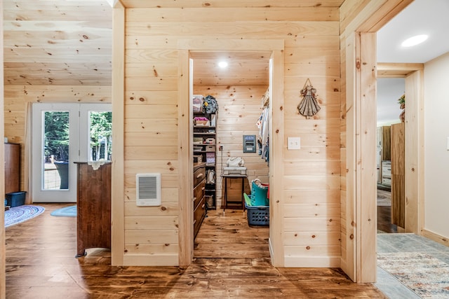 interior space featuring hardwood / wood-style flooring and wooden walls