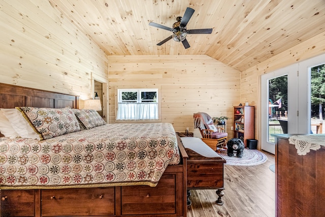 bedroom featuring lofted ceiling, access to exterior, wood ceiling, ceiling fan, and hardwood / wood-style flooring