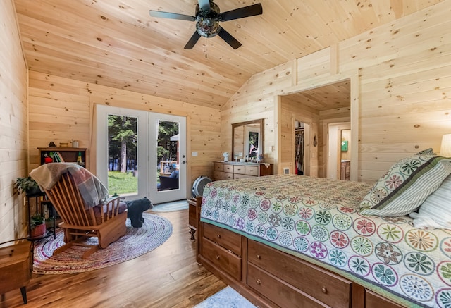 bedroom featuring ceiling fan, light hardwood / wood-style floors, lofted ceiling, access to exterior, and wood ceiling