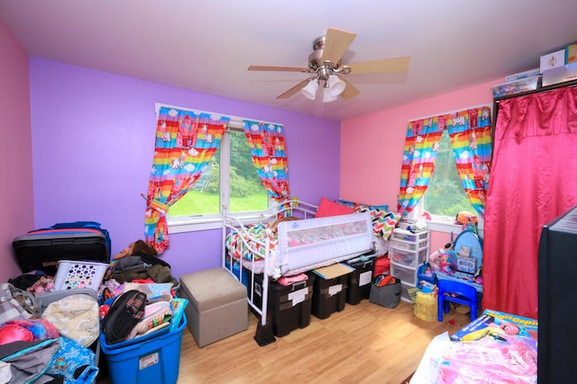 bedroom featuring light hardwood / wood-style flooring and ceiling fan