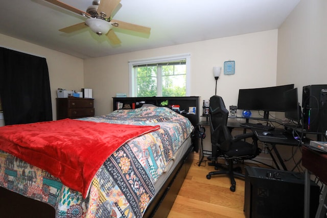 bedroom featuring light wood-type flooring and ceiling fan