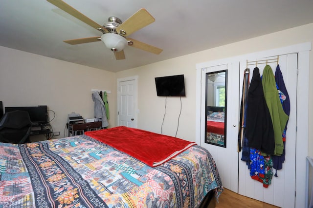 bedroom featuring wood-type flooring and ceiling fan