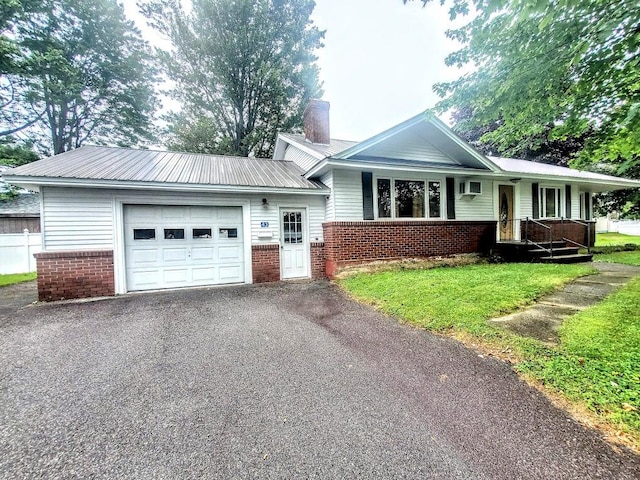 view of front facade featuring a garage and a front lawn