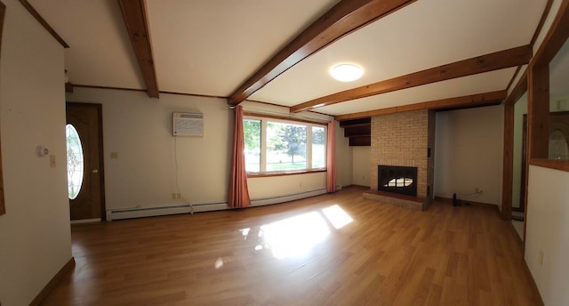 unfurnished living room featuring hardwood / wood-style floors, brick wall, baseboard heating, and a fireplace