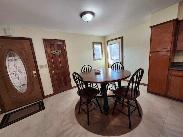 dining room featuring light tile patterned floors