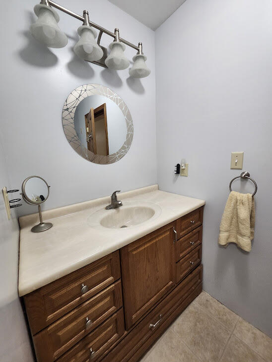 bathroom with vanity and tile patterned floors