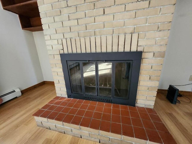 interior details with a fireplace and wood-type flooring