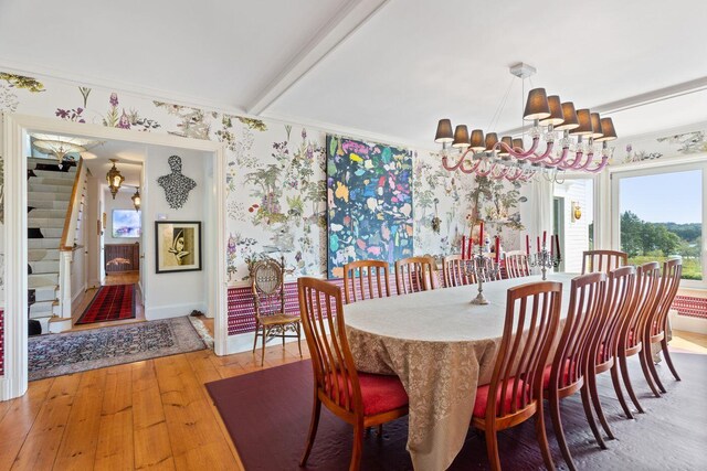 dining room with crown molding and hardwood / wood-style floors