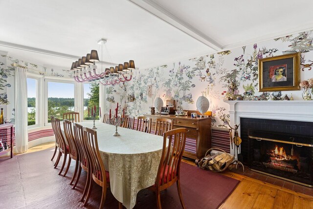 dining space featuring hardwood / wood-style flooring and a tile fireplace