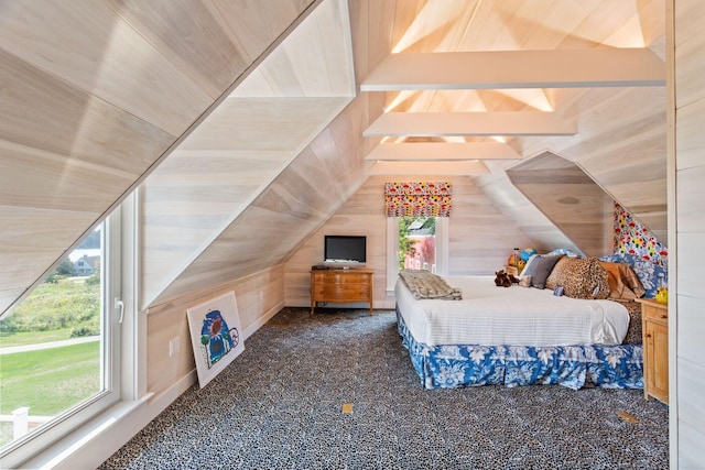 bedroom featuring carpet, wooden walls, and vaulted ceiling