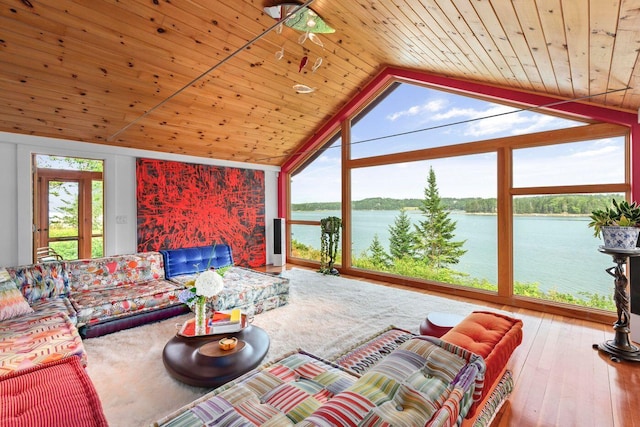 living room with a water view, wooden ceiling, hardwood / wood-style flooring, and high vaulted ceiling