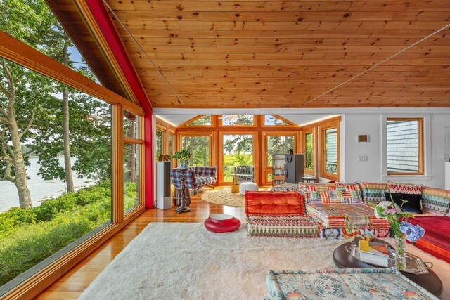 sunroom featuring wooden ceiling and vaulted ceiling