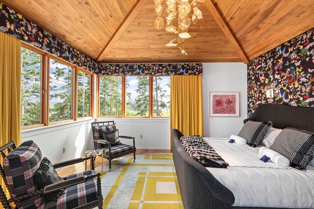 bedroom featuring wooden ceiling, lofted ceiling, and a chandelier