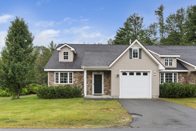 view of front facade with a garage and a front yard