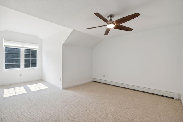 bonus room featuring lofted ceiling, a baseboard heating unit, light colored carpet, and ceiling fan