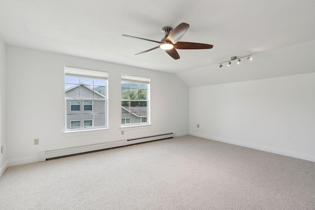 additional living space featuring lofted ceiling, baseboard heating, light colored carpet, and ceiling fan