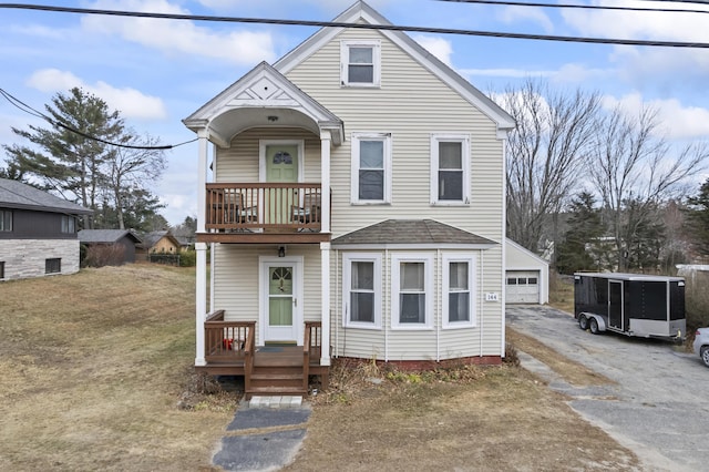 view of front of home featuring a garage and an outdoor structure