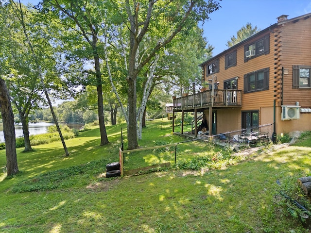 view of yard featuring a deck with water view