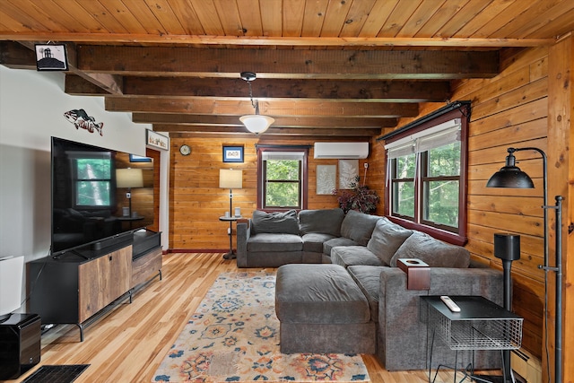 living room with a wall mounted AC, light wood-type flooring, wooden ceiling, beamed ceiling, and wood walls