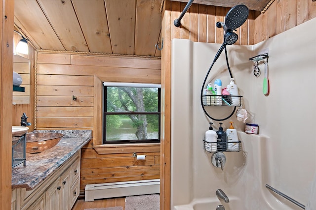 bathroom featuring wood walls, shower / bathing tub combination, wooden ceiling, vanity, and a baseboard heating unit