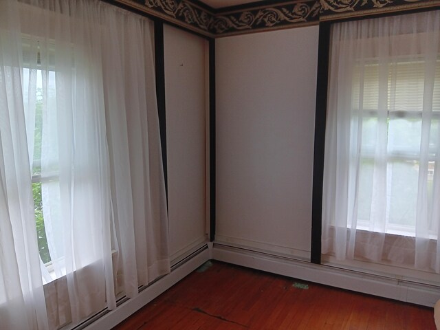 spare room featuring dark hardwood / wood-style flooring