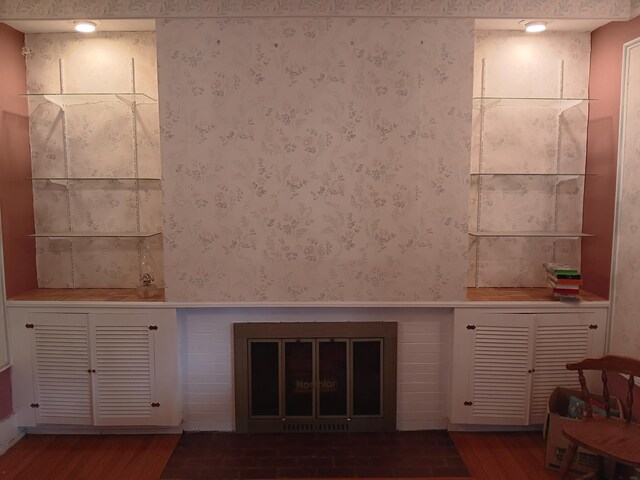 unfurnished living room with dark hardwood / wood-style flooring