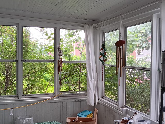 unfurnished sunroom with a wealth of natural light