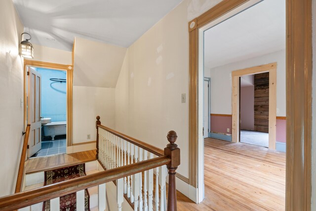 hall with light hardwood / wood-style floors