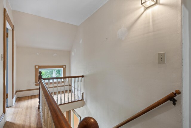 interior space featuring hardwood / wood-style flooring and high vaulted ceiling