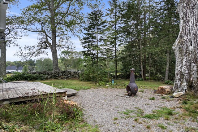 view of yard with a wooden deck