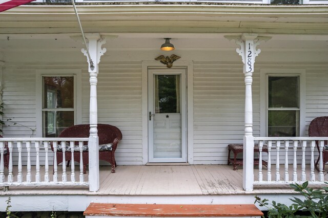 doorway to property with a porch