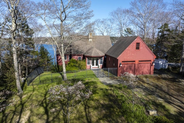 view of front facade with a garage and a front lawn