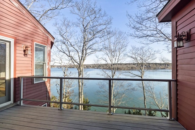 wooden deck featuring a water view