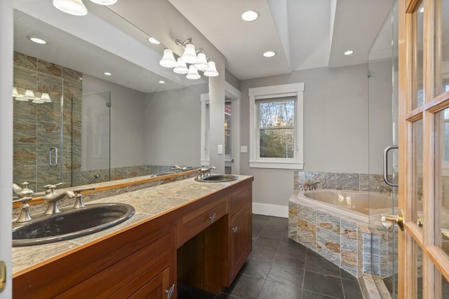 bathroom with vanity and independent shower and bath