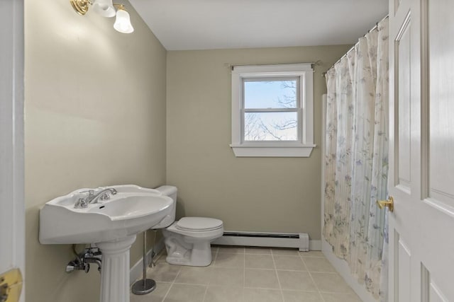 bathroom featuring a shower with curtain, tile patterned floors, toilet, and a baseboard heating unit