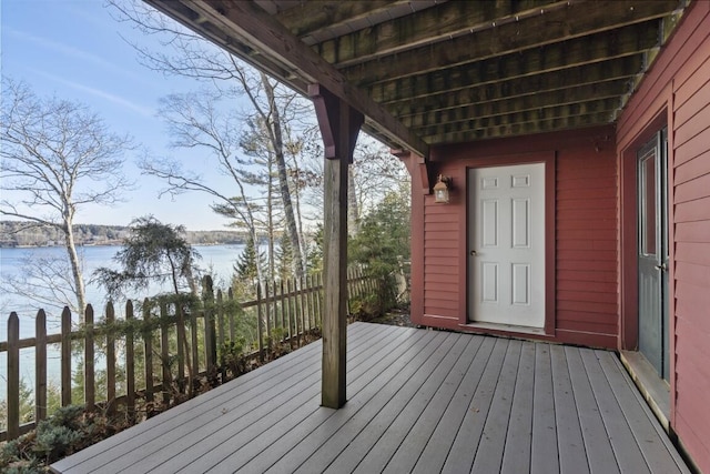 wooden deck featuring a water view