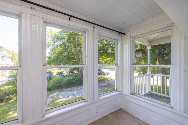 unfurnished sunroom with plenty of natural light