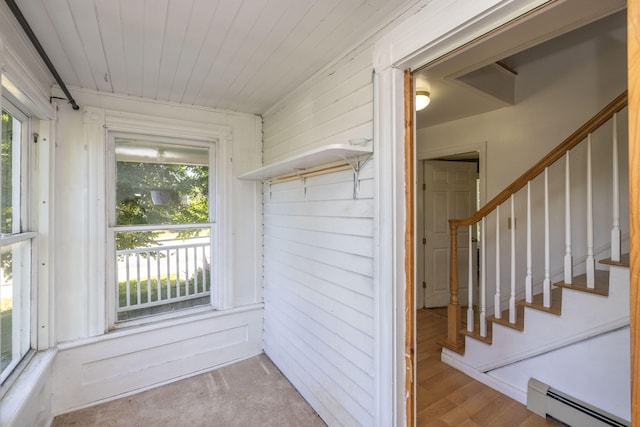 unfurnished sunroom with a baseboard radiator