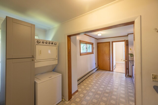 laundry area featuring ornamental molding, stacked washer / drying machine, and a baseboard radiator