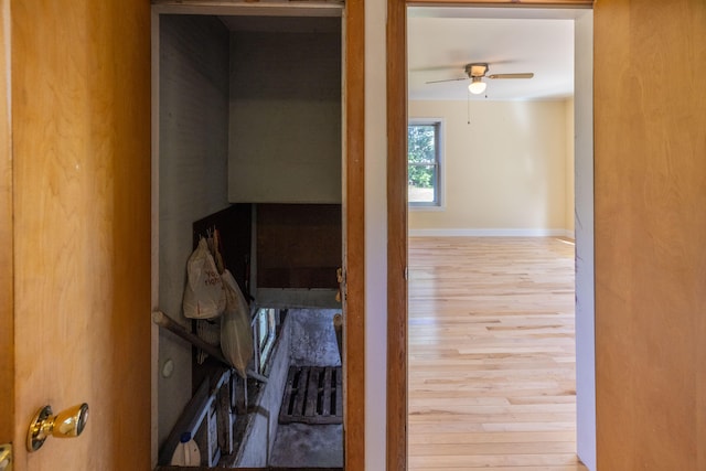 hall with hardwood / wood-style floors