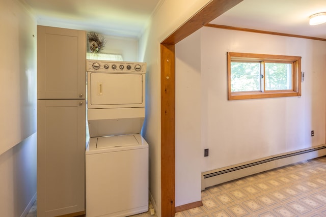 washroom featuring a baseboard heating unit, stacked washer and clothes dryer, and ornamental molding