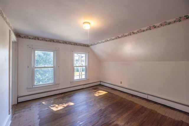 bonus room featuring lofted ceiling, hardwood / wood-style floors, and a baseboard heating unit