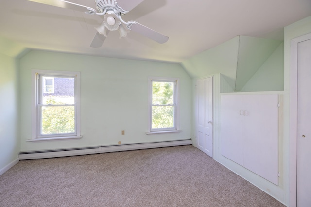 bonus room featuring lofted ceiling, plenty of natural light, baseboard heating, and ceiling fan