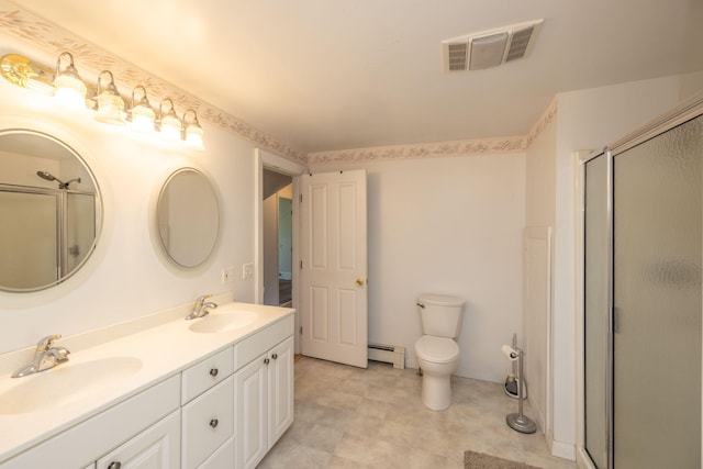 bathroom with toilet, baseboard heating, a shower with door, and vanity