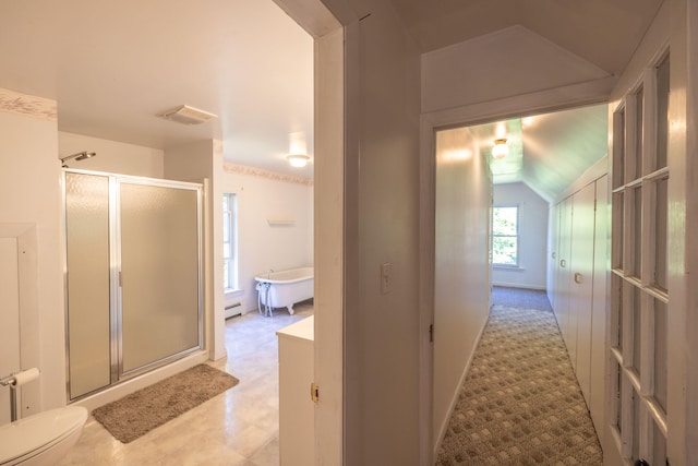 hallway with a baseboard heating unit and lofted ceiling