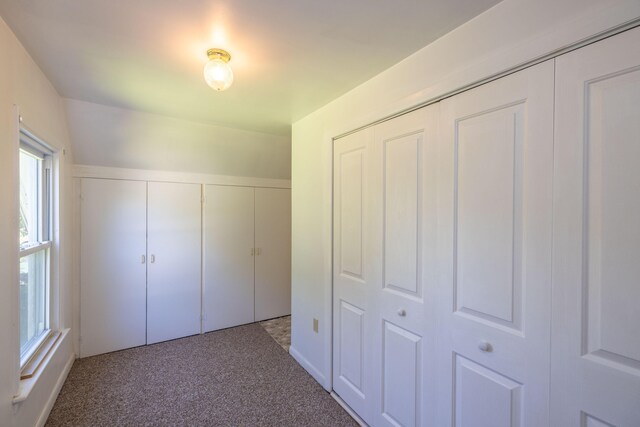 unfurnished bedroom featuring carpet flooring