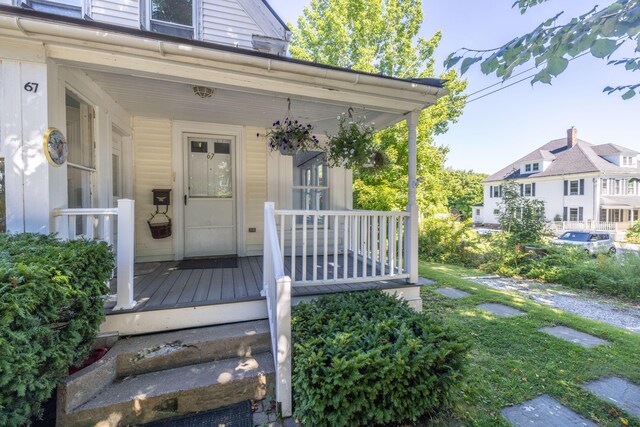 doorway to property with covered porch