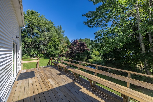 wooden deck with a yard